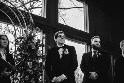 Groom looking at bride at the Vale in Conroe